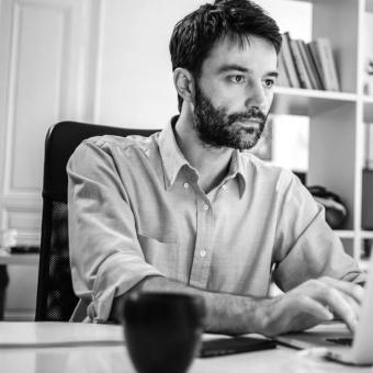 Determined businessman working on computer